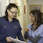 Dr. Holly Lin Consulting with Colleague - Dentist in Livonia, MI